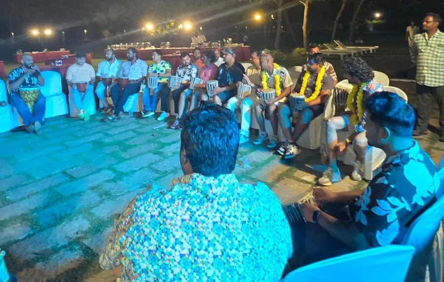 High energy corporate drum circle session with enthusiastic participants